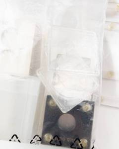 lot 149 image: 1 bag of vintage plastic Capital  holders. 1 Bag of misc. coin supplies