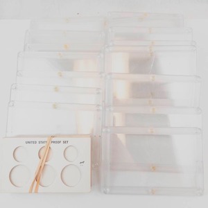 lot 149 image: 1 bag of vintage plastic Capital  holders. 1 Bag of misc. coin supplies