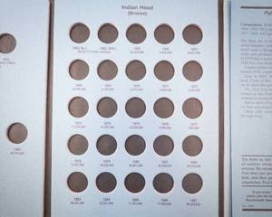 lot 162 image: Indian Head cent starter set with a new Whitman folder and a roll of IHP at least 25 dates