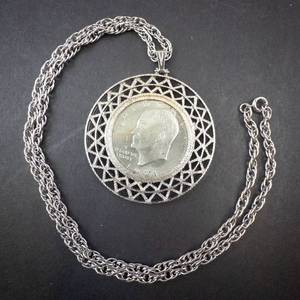lot 314 image: 1971 Ike dollar pendant on Stainless rope chain