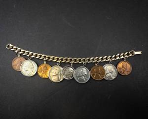 lot 315 image: US coin charm bracelet with 1954 silver dime and 1944 silver war nickel, wheat cents