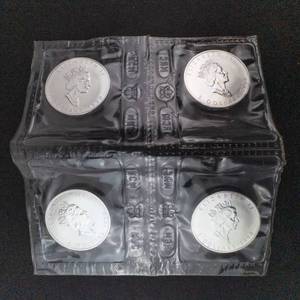 lot 65O image: 4 Uncirculated 1990 Canadian Silver Dollars