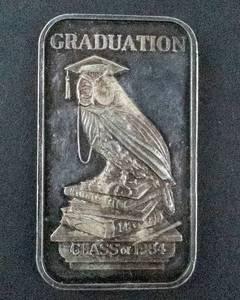 lot 68J image: 1984 Madison Mint Graduation .999 Fine Silver 1 Oz -John J Kennedy High School Kristin Benson June 6 1984
