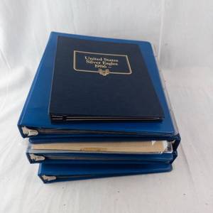 lot 151A image: 4 (Empty) Coin Binders and US Silver Eagles 1986 Collection Booklet