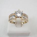 Lady’s 14K Yellow Gold Cubic Zirconia Ring with Baguette & Round Accents. Ring Size 10.