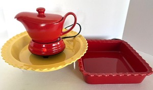 lot 33 image: Red GravySyrup with Warmer Base, Yellow Chantal 10-Inch Fluted Bakeware and Red Chantal Square Baker