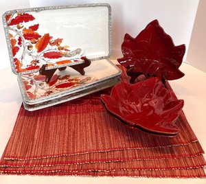 lot 48 image: Red Leaf-Shaped Ceramic Bowls Set, Kate Williams Plate & Red Woven Placemats