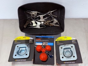 lot 44 image: Heavy Duty Trailer Tie-Down D-Rings, CURT Coupler Lock, and Metal Spring Clamps.