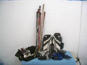lot 74 image: Hockey Gear - Sticks, Street Goalie Pads, Skates, Bag