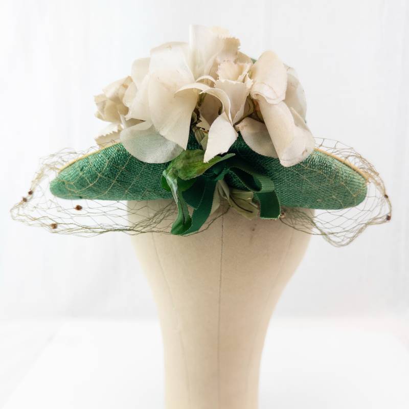lot 105 image: Green Straw Hat with Cream Floral Accent, Net Veil, and Ribbon Trim - Vintage Style