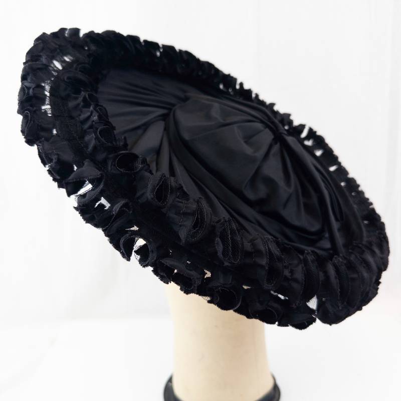 lot 109 image: Luetta Model - Black Satin Hat with Frilled Edge - Size 22