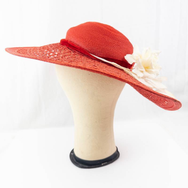 lot 110 image: Maurice L Rothschild Hat - Red Straw Wide-Brim with White Floral Accent