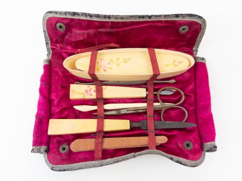 lot 111 image: Ivory-Toned Manicure Set in Pink Velvet Case - Vintage Travel Kit