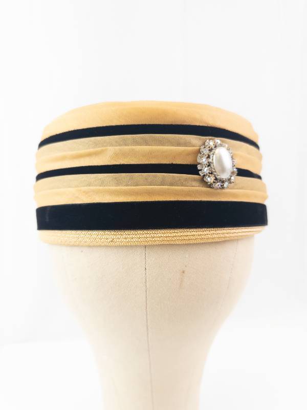 lot 133 image: Gold Woven Cloche Hat with Black Ribbon Stripes & Pearl Rhinestone Brooch