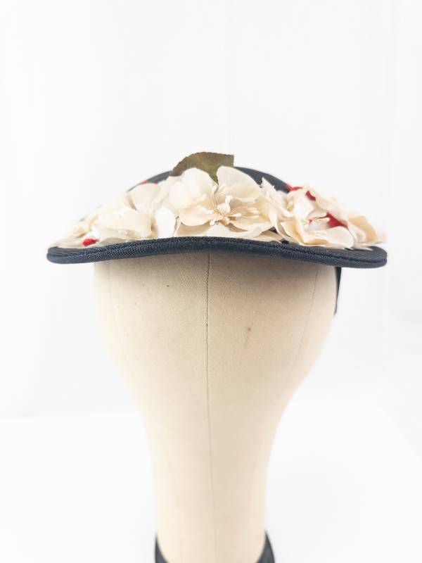 lot 136 image: Black Floral Fascinator Hat With Cream Flowers And Green Leaves - Headpiece