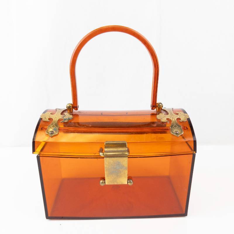 lot 163 image: Vintage Jewelry BoxPurse - Amber Plastic with Brass Hardware & Handle
