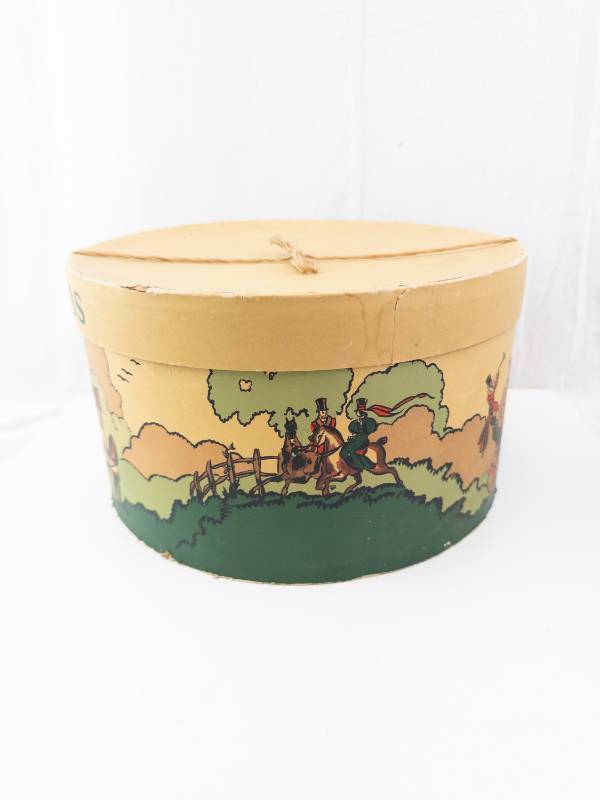 lot 233 image: Dobbs Round Hat Box with Carriage Scene - Vintage Decorative Tin