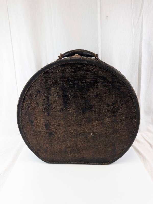 lot 244 image: Vintage Round Leather Case For Storage For Hats Etc.- Patterned Interior