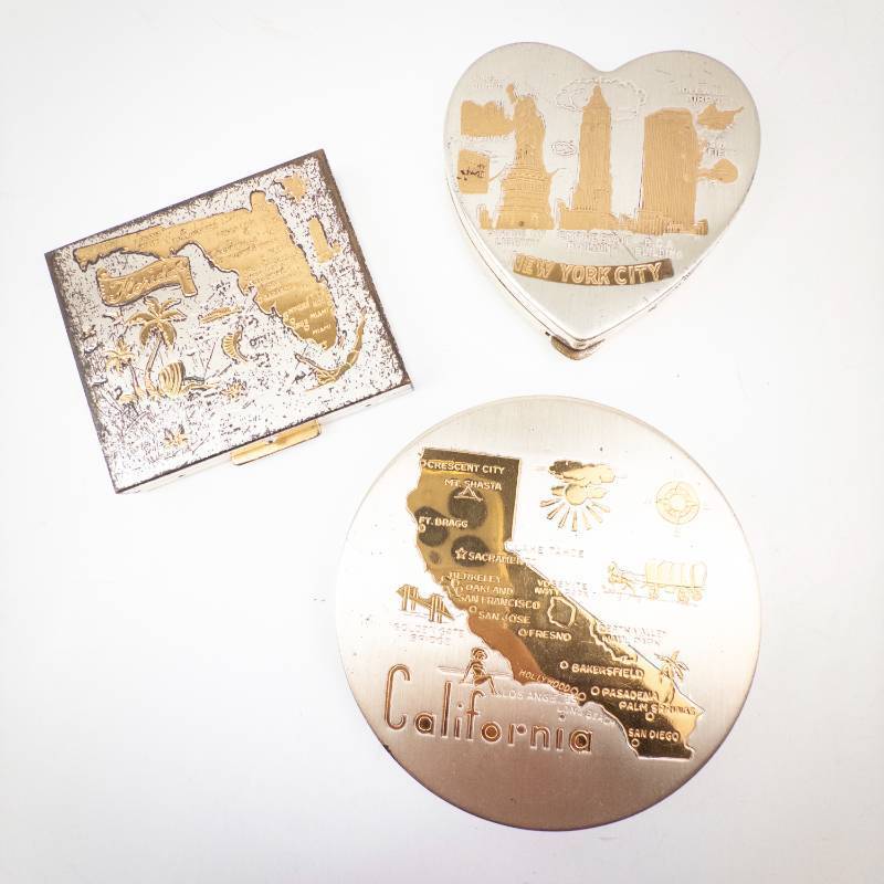 lot 269 image: RITZ Gold-Tone Powder Compact - City Souvenir Lot California, New York City, Florida