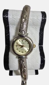 lot 34 image: L.A. Express ladies wristwatch with a two-tone silver and gold bangle bracelet.