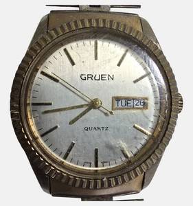 lot 35 image: Vintage 1970s Gruen Day-Date Quartz watch with gold -plated bezel and stainless steel bracelet