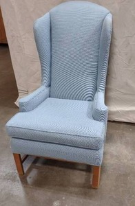 lot 55 image: Upholstered Blue Winged-Back Chair