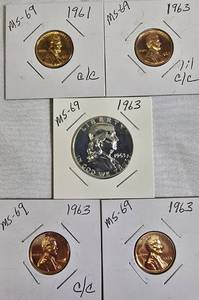 lot 47 image: 1963 Franklin Half Dollar, graded MS-69, plus four pennies from 1961 and 1963 with varying grades and defects.
