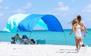 lot 341 image: New Shibumi Shade� Classic with Quiet Canopy, The Original Wind-Powered� Beach Shade, Shade for 8 People, Weighs Only 4 lbs, Sets up in 3 Minutes. Wind Assist Included (Used, Transit Damage, One Pole Is Broken)