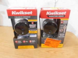 lot 124 image: Set of Two-- Kwikset Uptown Low Profile Iron Black Round Contemporary Single Cylinder Deadbolt featuring SmartKey Security