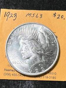 lot 27 image: 1923 US PEACE SILVER DOLLAR MS63
