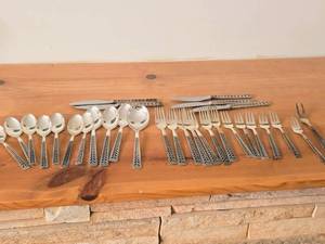 lot 1097 image: Lot of (29 Piece) 1084-grams (total) 830 Silver Flatware Set - Knifes (x5), Dinner Forks (x7), Salad Forks (x6), Small Spoons (x7), Large Spoons (x3), Serving Spoon, 2-tine Fork - Juvel by Nils Hanson (Norway)