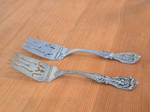 lot 1112 image: Lot of (2) 8 157-grams (total) Sterling Silver Pierced Fish  Cold Meat Serving Forks - Francis I by Reed & Barton