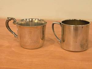 lot 1166 image: 233-grams (total) (1) Empire Classic Sterling Baby Cup, (1) Lunt Sterling Silver JuiceBaby Cup