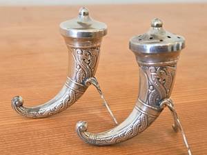 lot 1180 image: Lot of (1) 2 12 37-grams (total) Viking Horn theme Sterling Silver Salt and Pepper Shaker Set of 2 (Norway)