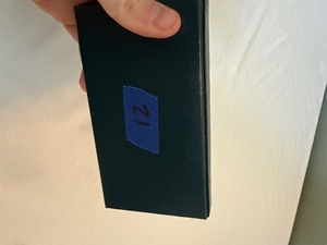 lot 21 image: 1991 Korean War Proof Memorial Coin Dollar - original package with COA, slight fire damage is evident