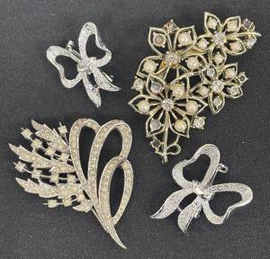 lot 132DZ image: DZ - Four Silver-Tone Brooches