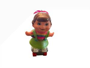 lot 36 image: Small Shots Girl Doll on Roller Skates - Rainbow Knit Top with Lime-Green Pinafore