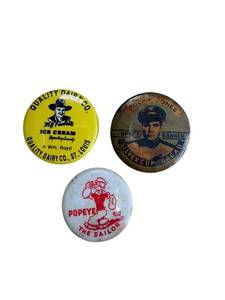 lot 63 image: Vintage Pinback Button Lot - Popeye The Sailor, Rocky Jones Space Ranger, Quality Dairy Co. (4 pc)