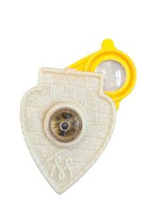 lot 77 image: Tom Mix Straight Shooters Compass Pendant - Heart-Shaped White Charm with Yellow Bail