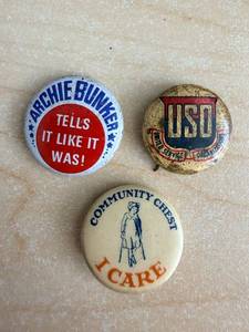 lot 92 image: Vintage Archie Bunker Button Set - USO - Community Chest I Care (3-Pc)
