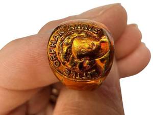 lot 129 image: Little Orphan Annie Face Ring - Gold-Tone Portrait Jewelry
