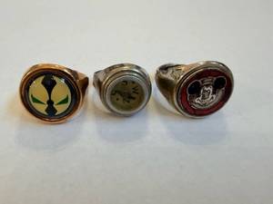 lot 151 image: Signet Ring Set - Mickey Mouse Inlay, Abstract Crest, Plain Dial (3 Rings)