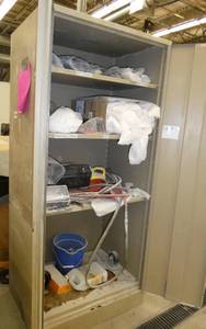 lot 108 image: Cabinet full of lab clothing, face shields