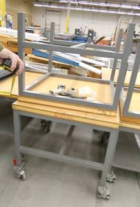 lot 122 image: Two tables one with wheels