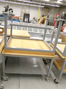 lot 123 image: Two tables on wheels 30x36x29 and 30x38x26