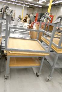 lot 124 image: Two tables on wheels 31x34x29 and 30x30x25