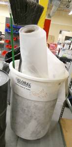 lot 261 image: garbage barrel with roll of poly and broom