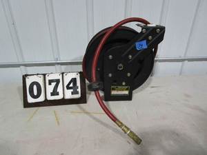 lot 74 image: Central Pneumatic Auto Rewind Hose Reel whose