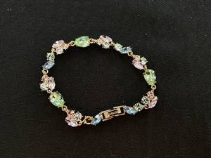 lot 103 image: Givenchy Womens Gold Pastel Crystal Bracelet (Missing 1 Stone)