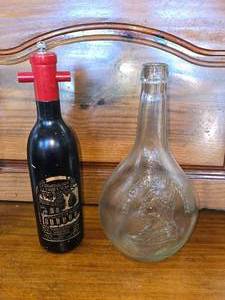 lot 11 image: Glass George Washington Flask and Pepper Grinder Shaped as a Wine Bottle.